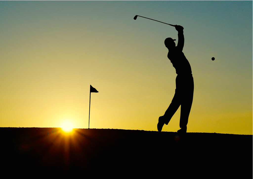 Golfing near Walker MN Leech Lake MN golfer back lit